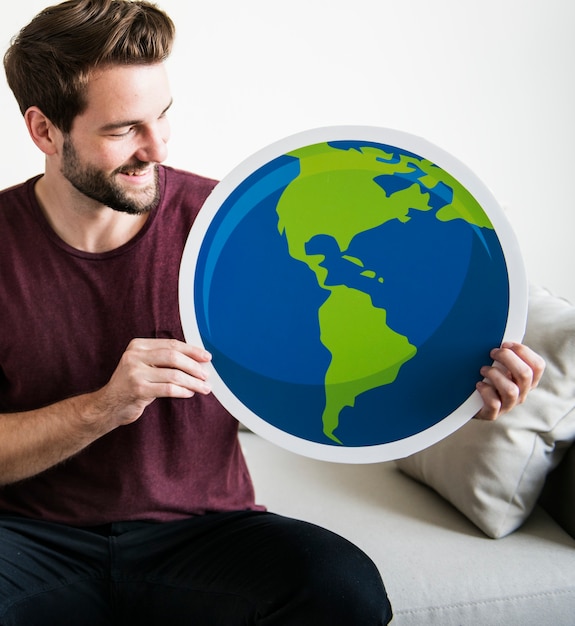 Free photo white man holding globe icon