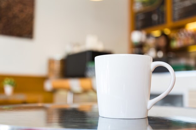 White mug with blurred background