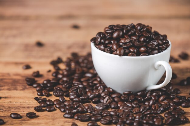 White mug with coffee beans