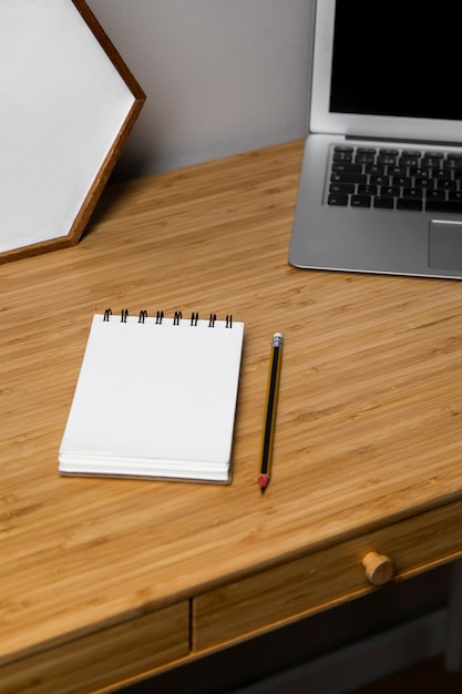 White notebook on wooden table