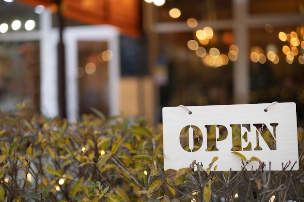 White open sign in bush