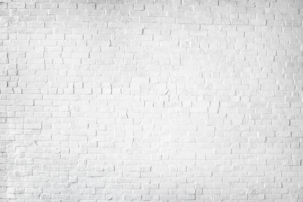 Белая окрашенная красивая кирпичная стена