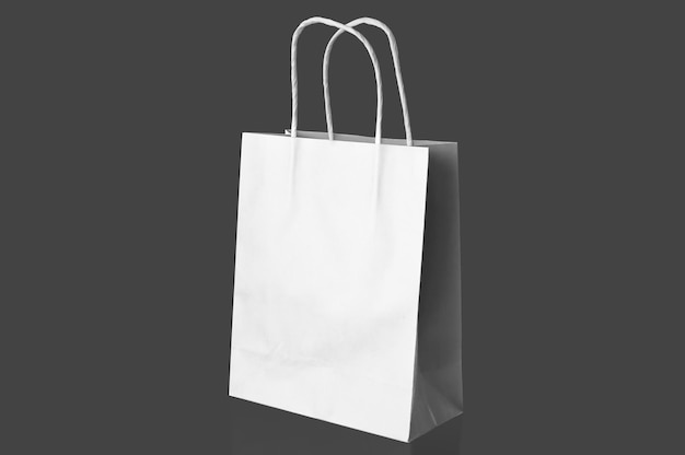 White paper bag over grey surface