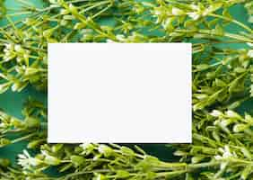 Free photo white paper on floral background