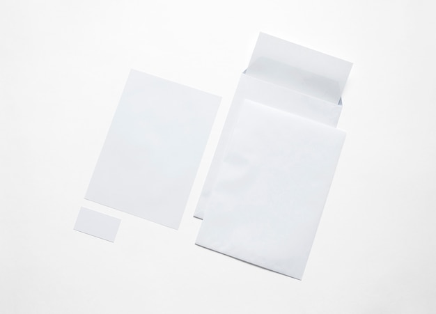 White paper stationery isolated on white. Illustration with blank envelopes, letterheads and cards to showcase your presentation.