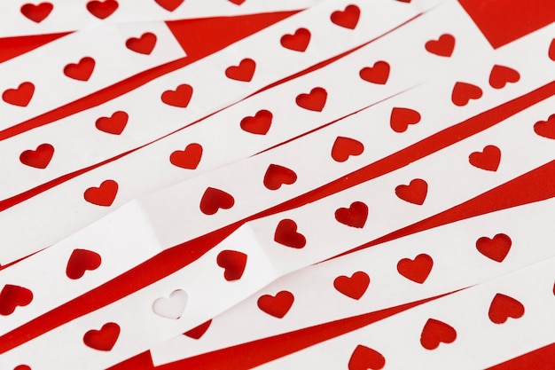 Free photo white papers with cut hearts