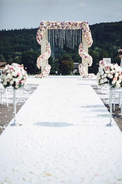 White path leads to wedding altar put somewhere in the mountains