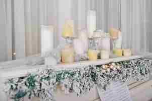 Free photo white piano with candles happy winter holidays concept