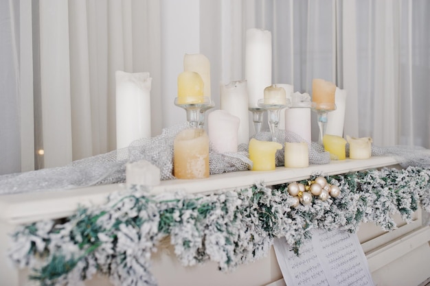 White piano with candles Happy winter holidays concept