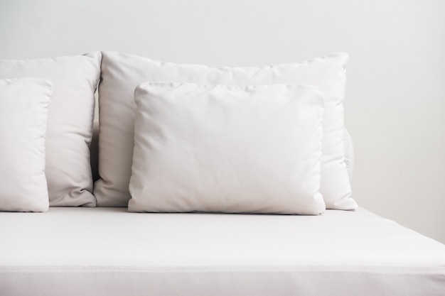 Free photo white pillows stacked