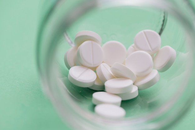 White pills in jar arrangement