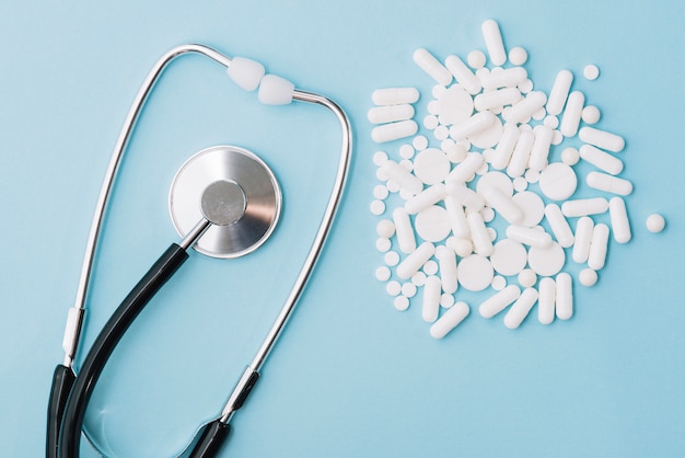White pills and stethoscope