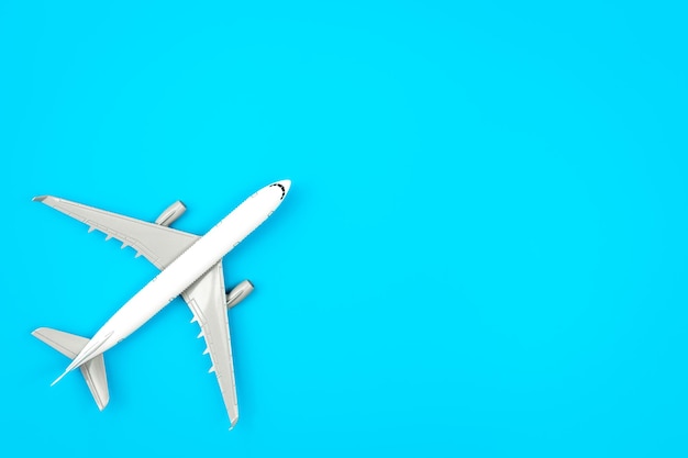 White plane airplane on a blue background flat lay copy space