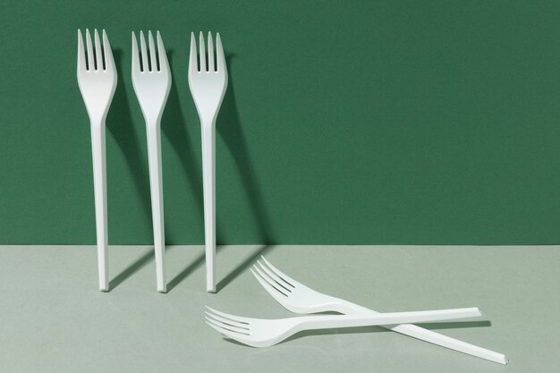 White plastic forks copy space