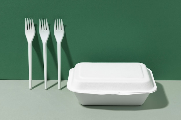 White plastic forks and fast food container