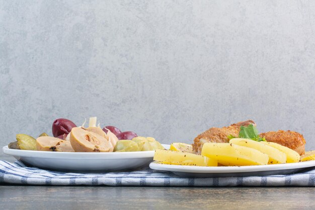 A white plate full of salty vegetables on tablecloth. High quality photo