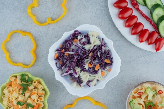 White plate of macaroni and cabbage on white plate. High quality photo