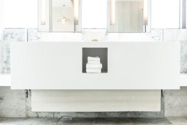 White porcelain sink with towels