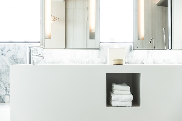 White porcelain sink with towels