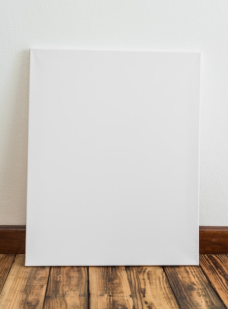 White poster leaning against a wall