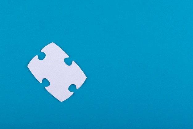 White puzzle pieces with blue background