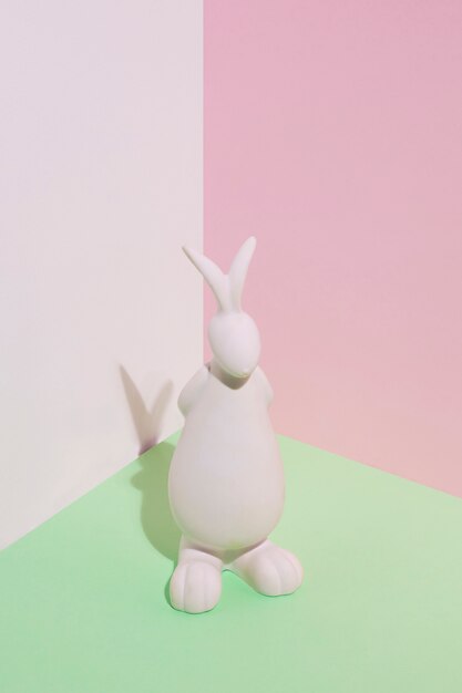 White rabbit figurine on green table