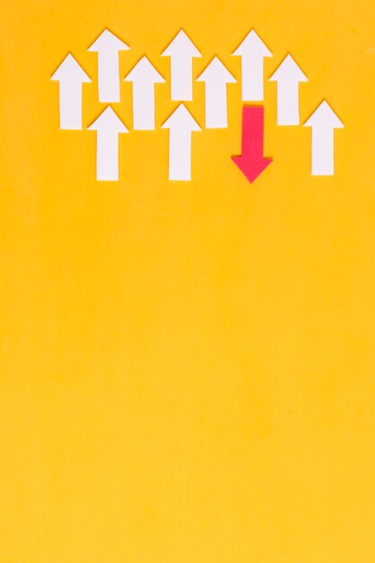 white and red arrows on yellow background