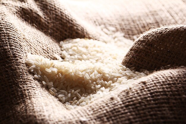 White rice grains on sack cloth