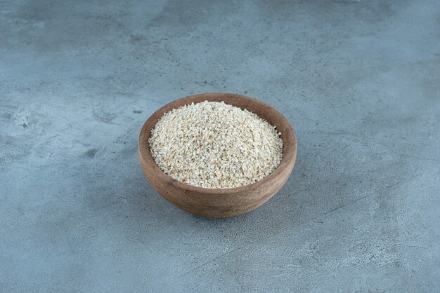 White rice inside a wooden cup. High quality photo