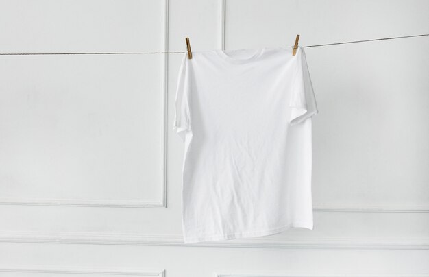 White shirt hanging by the wall