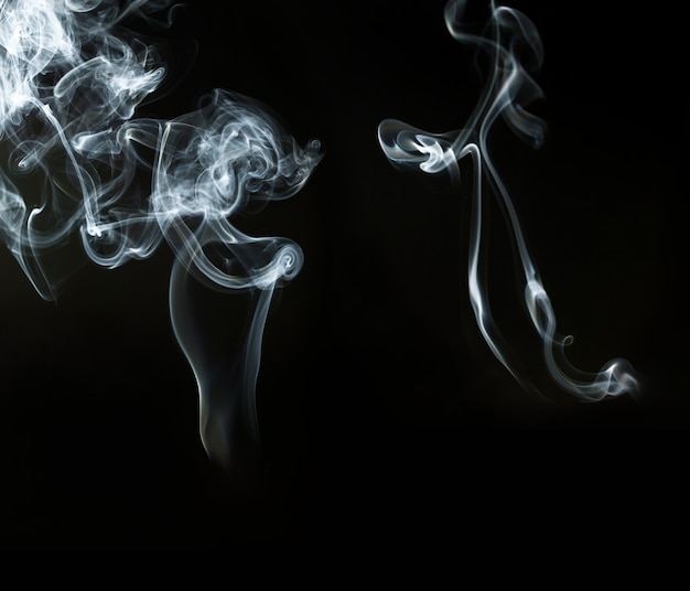 White smoke on black background