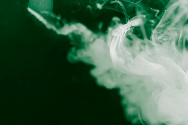 Free photo white smoke design with inverted filter