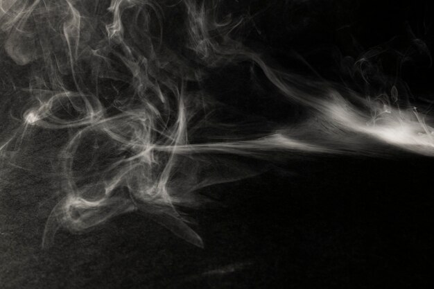 White smoke effect on a black background wallpaper