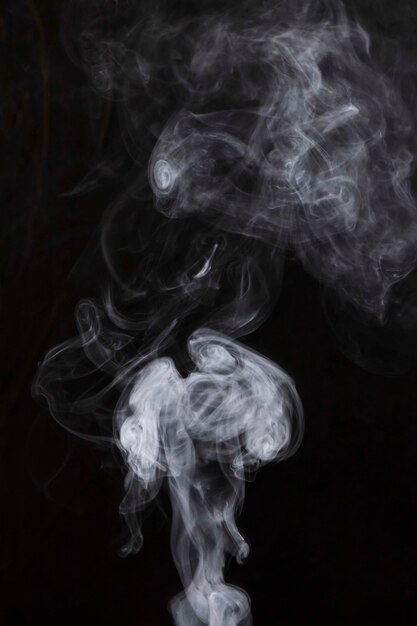 White smoke movement on black background