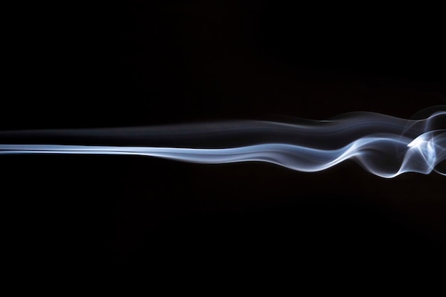 White smoky swirls abstract on black background