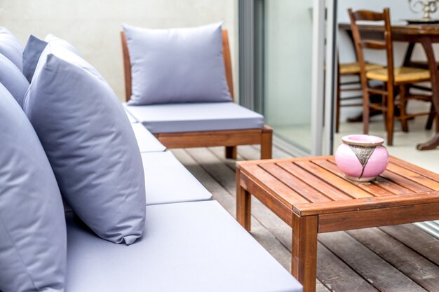 White sofa with a coach and a wooden table-interior design