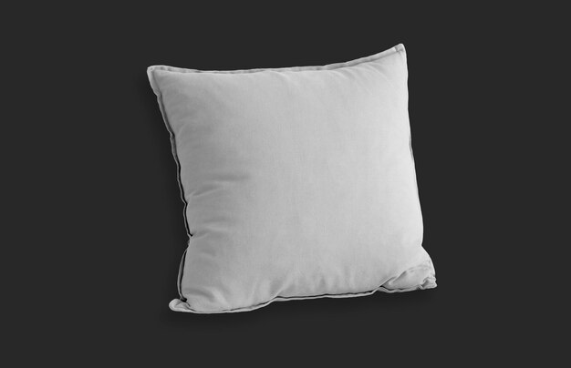 黒い表面上の白い四角い枕
