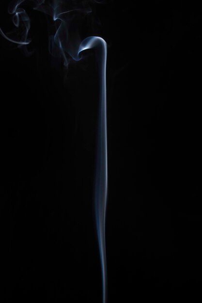 White steaming smoke on black background