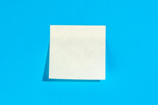 White sticker with space for text on a blue background top view