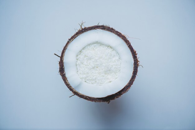 White surface with half coconut