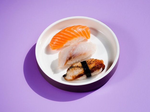 White sushi plate on a blue background