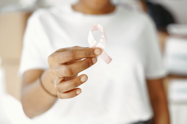 White t-shirt. Fight against AIDS. Sign with ribbon.