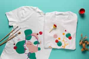 Free photo white t-shirt with diy design painted with colors