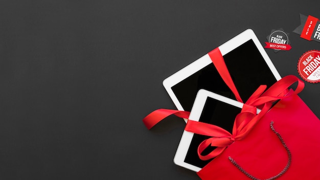 White tablets with red ribbons in packet between labels