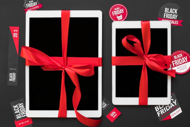 Free photo white tablets with ribbons between sale stickers