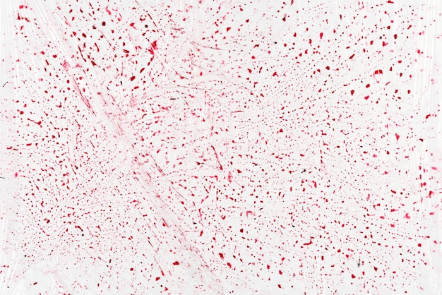 White textural background with red drops.