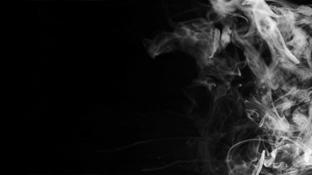 White textured wispy smoke against black background