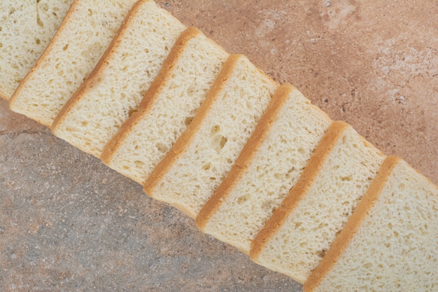 Free photo white toast slices on marble background