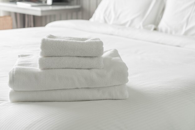 White towel on bed decoration in bedroom interior