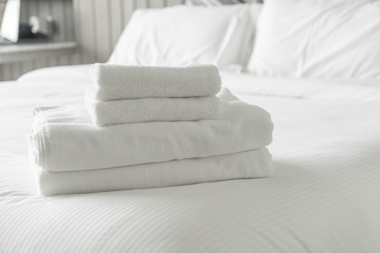 Free Photo white towel on bed decoration in bedroom interior